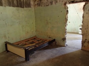 Abandoned Building with Bed